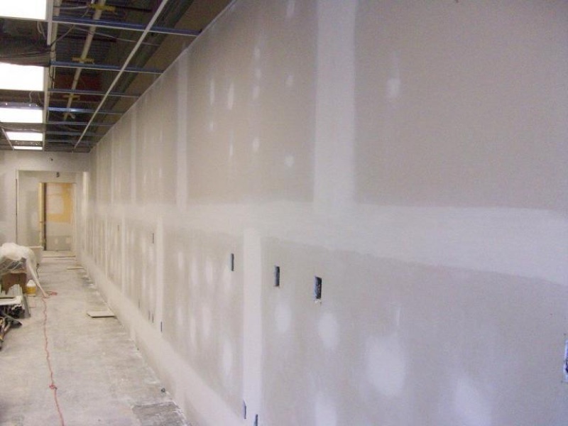 Drywall installation on a framed wall